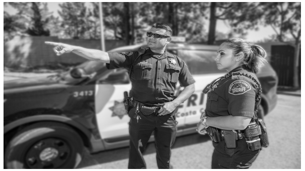 Photo of Officers and their vehicle